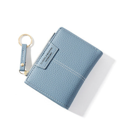 Petit portefeuille à coutures apparentes bleu